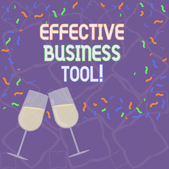 Handwriting text Effective Business Tool. Concept meaning used to control and improve business processes Filled Wine Glass Toasting for Celebration with Scattered Confetti photo