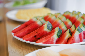 pieces of watermelon ready for breakfast on table in hotel