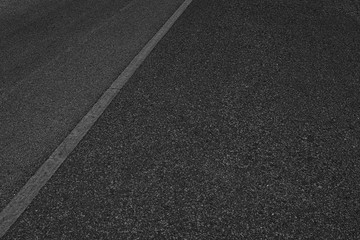 Fototapeta premium Asphalt road with marking lines white stripes texture Background.