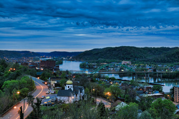 This is an aerial view of Wheeling, West Virginia along the Ohio River.  This skyline cityscape shows Wheeling Island in the distance.