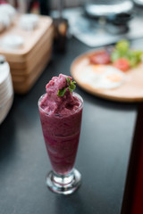 blueberry smoothie, mint leaf on top