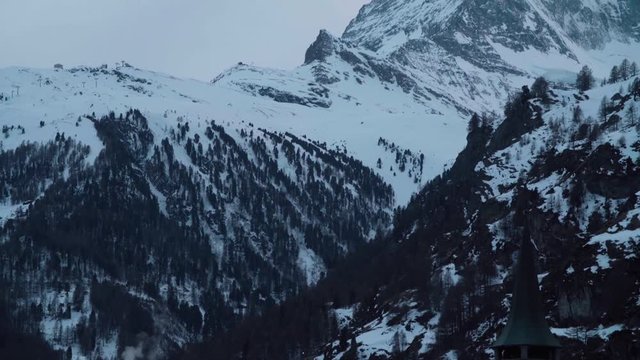 Pan up to the Matterhorn from an old ski village