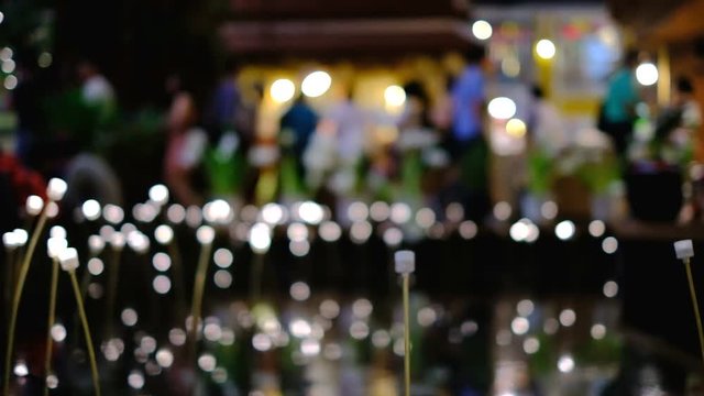 Flower lanterns bokeh light at night market scene background