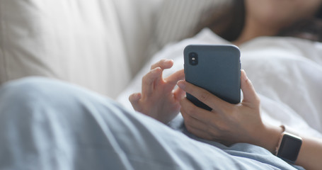 Woman use of mobile phone at home