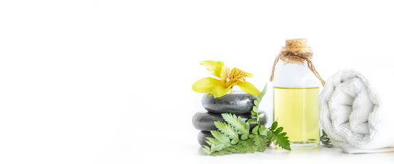 Oil aroma from flower, Beautiful Stones spa composition on white background. For Banner Website free text space Graphic Design. 