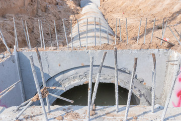 Concrete Drainage Pipe on a Construction Site, Concrete drainage tank on construction site,...