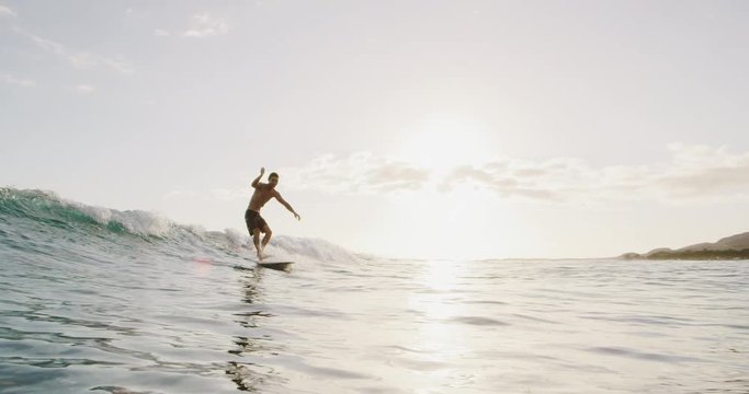 Young Man Surfing A Wave With Style On His Longboard At Sunset, Summer Fun Surfing Adventure