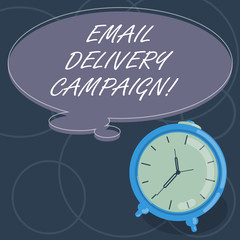 Word writing text Email Delivery Campaign. Business concept for sending a commercial message to a group of showing Blank Color Thought Speech Bubble with Outline and Alarm Clock photo