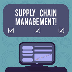 Conceptual hand writing showing Supply Chain Management. Business photo showcasing analysisagement of the flow of goods and services Mounted Computer Screen with Line Graph on Desk Text Box