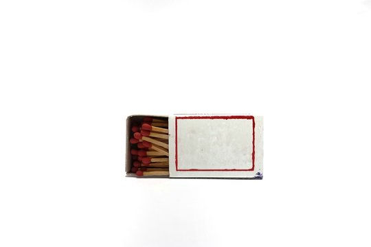 Wooden match in the box isolated