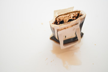 Used coffee drip bag on white background.
