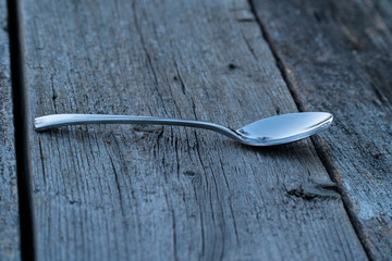 knife and fork on wooden background. Cutlery on wooden.