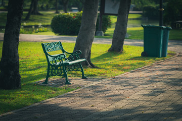 Chairs in the park in warm light conditions in the evening