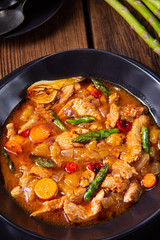 colorful turkey fricassee with asparagus and paprika