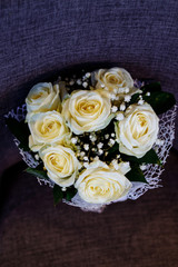 Wedding bouquet made of white roses on a natural background