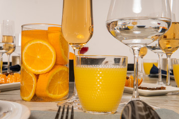 Rustic table setting with pink flowers and candle on light wooden table. Holidays decoration on Provence style. Romantic dinner. Overhead