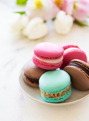 Colorful macaroons and tulips