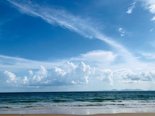 Beautiful blue sky and calm blue sea with white sand on the beach in the summer.