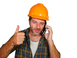 happy efficient and cheerful workman or contractor man wearing builder hat tallking with satisfied customer on mobile phone smiling confident isolated on white