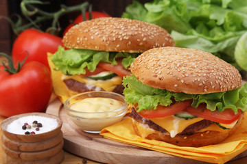 Two fresh hamburgers with vegetables	