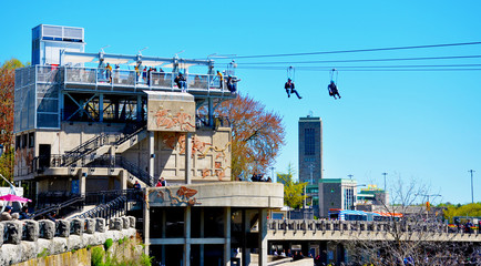 People using the Zip Line attraction over the Niagara Falls