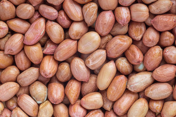 close up of raw peanuts background