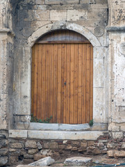 Fototapeta na wymiar Old wooden door with wall