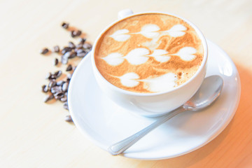 hot coffee on table / hot cappuccino with nice pattern milk foam 