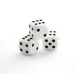 Three white plastic dices isolated on white