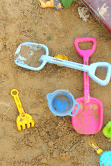 Fototapeta na wymiar children's toys in the sandbox