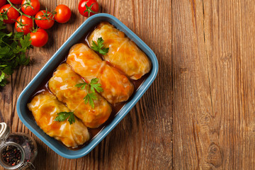 Traditional stuffed cabbage with minced meat and rice, served in a tomato sauce.
