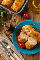 Traditional stuffed cabbage with minced meat and rice, served in a tomato sauce.