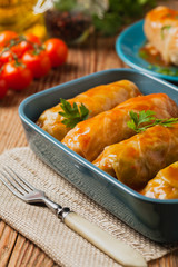 Traditional stuffed cabbage with minced meat and rice, served in a tomato sauce.