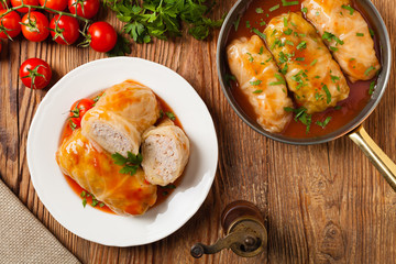 Traditional stuffed cabbage with minced meat and rice, served in a tomato sauce.