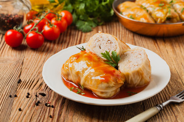 Traditional stuffed cabbage with minced meat and rice, served in a tomato sauce.