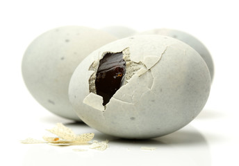 preserved duck eggs on white background