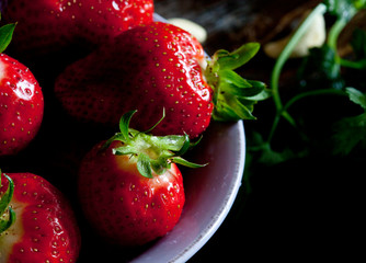 Delicious strawberries fresh in the bowl. Macro photography