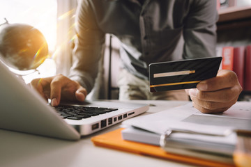 Business woman hands using smartphone and holding credit card with digital layer effect diagram as Online shopping concept