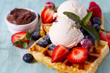 sweet belgian waffles with berries and ice cream