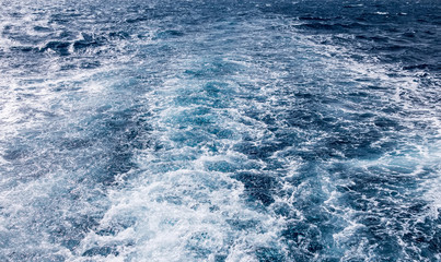 Fototapeta na wymiar cruise ship Wave ocean trace on blue sea fresh water background.