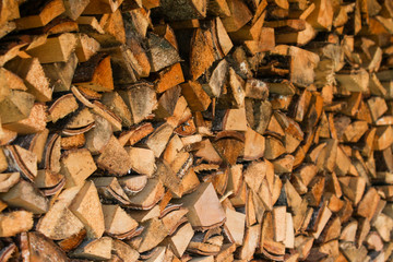 Beautiful view of stacked wood in a beautiful sunny day, countryside.