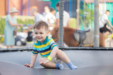Boy jumps on a trampoline park.