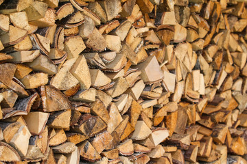 Beautiful view of stacked wood in a beautiful sunny day, countryside.