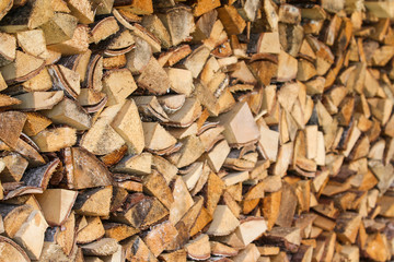 Beautiful view of stacked wood in a beautiful sunny day, countryside.