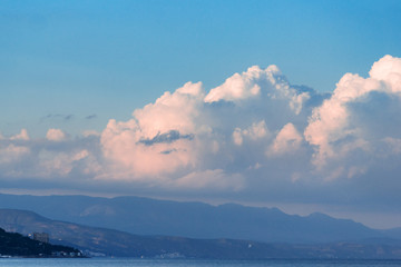 Beautiful white clouds on blue sky, and mountins.