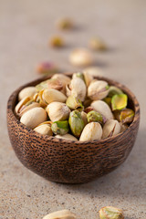 pistachio nuts on granite surface