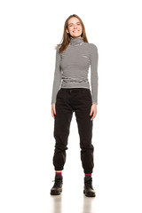 Young happy woman in blouse posing on white background