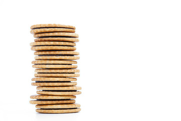 Heap of cookies with chocolate stuffing on white background