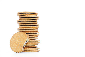 Heap of cookies with chocolate stuffing on white background