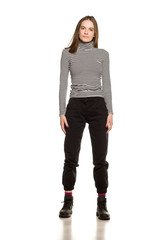 Young woman in blouse posing on white background